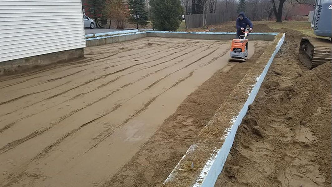 Land leveling for foundation preparation
